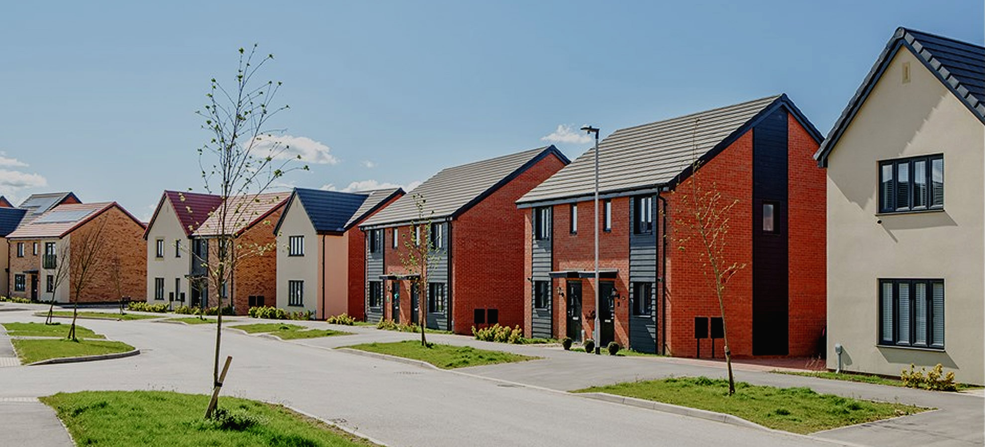Row of newly built family homes on a residential street